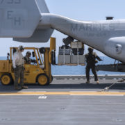 160510-N-VK310-067 ATLANTIC OCEAN (May 10, 2016) Marines use a forklift to remove cargo from an MV-22 Osprey on the flight deck of the amphibious assault ship USS Wasp (LHD 1). Wasp is underway with the Wasp Amphibious Ready Group participating in composite training unit exercise. (U.S. Navy photo by Mass Communication Specialist Seaman Michael Molina/Released)