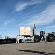 John "Buck" Buchanan, front right, watches as members of the 60th Aerial Port Squadron use a forklift to load a piece of cargo on Tuesday at Travis Air Force Base. Buchanan has been a mentor for and part of the 60th Aerial Port Squadron since the 1990's. (Aaron Rosenblatt/Daily Republic)