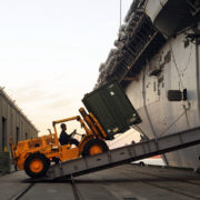 100115-N-5345W-071MOREHEAD CITY, N.C. (Jan. 15, 2010) A forklift driver loads relief supplies aboard the multi-purpose amphibious assault ship USS Bataan (LHD 5). The Bataan Amphibious Relief Mission is preparing to provide humanitarian assistance and disaster response to Haiti, which was devastated by a 7.0 magnitude earthquake on Jan. 12, 2010. (U.S. Navy photo by Mass Communication Specialist 2nd Class Kristopher Wilson/Released)